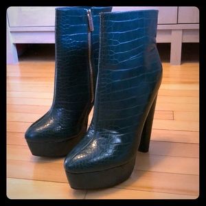 Green faux crocodile booties. Never been worn.